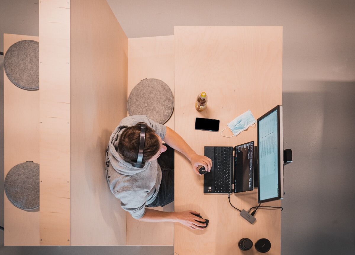 person sitting in an office booth