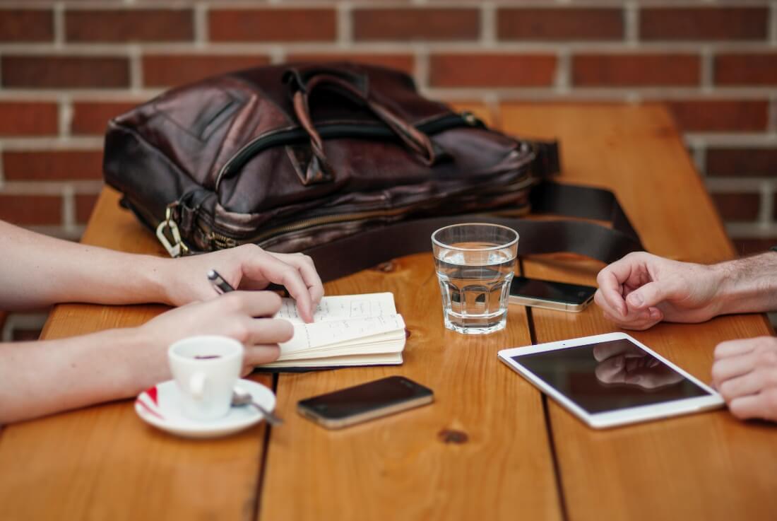 Flexible workers in the cafe working through a topic