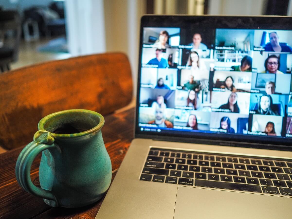 big remote team on a meeting with a cup of tea