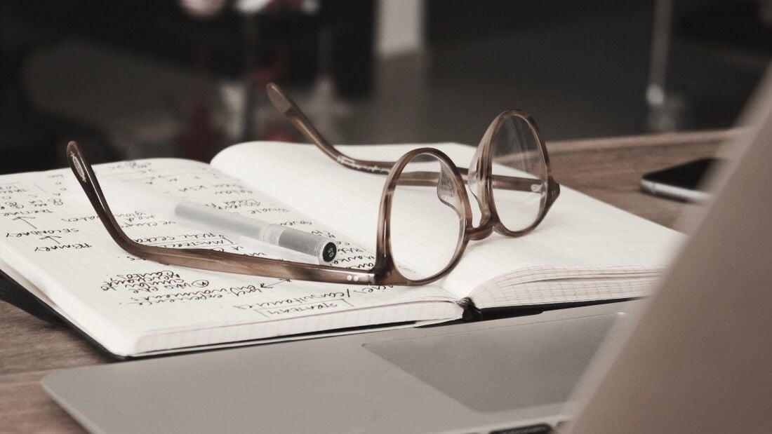 A picture of a notebook with research on it about flexible jobs