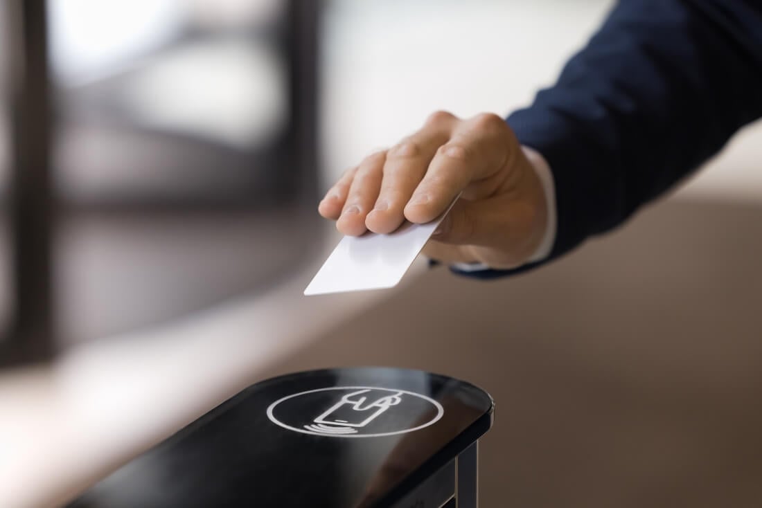 employee using their office badge to enter a building