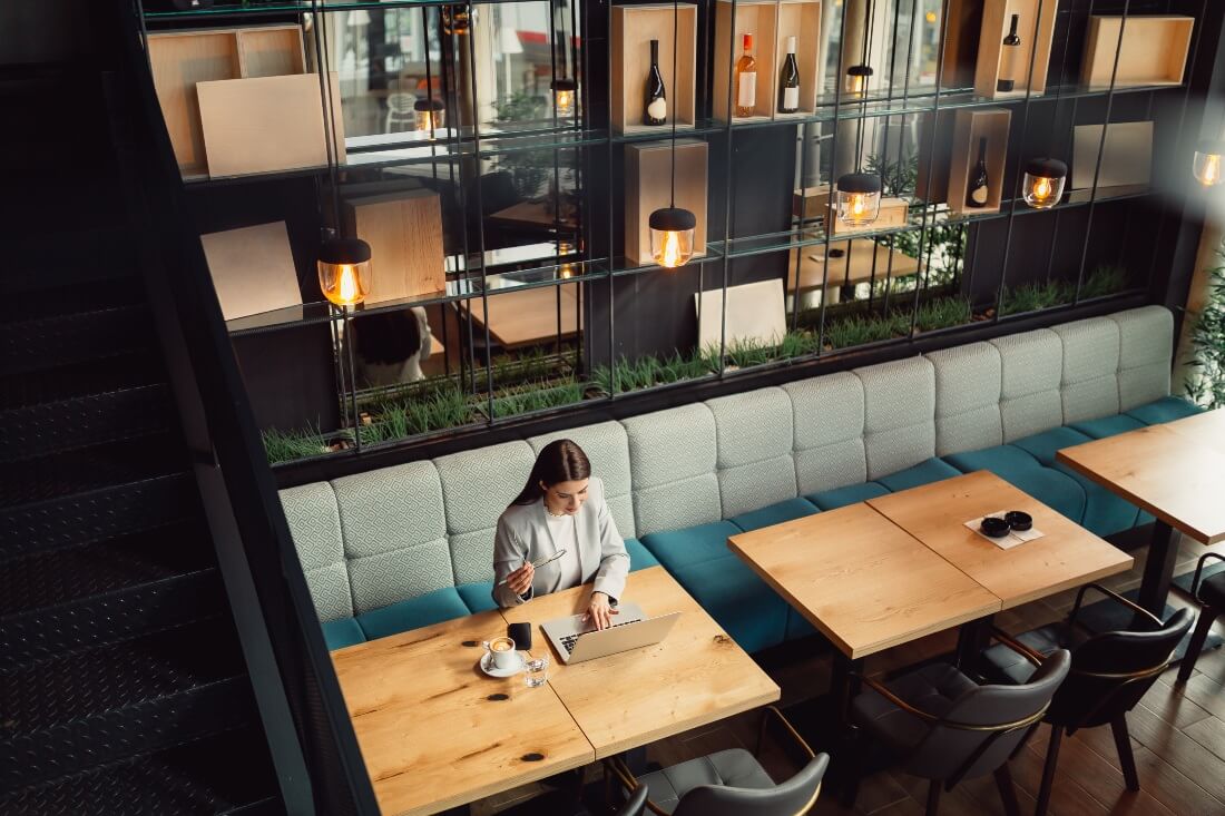 a lady working from a cafe